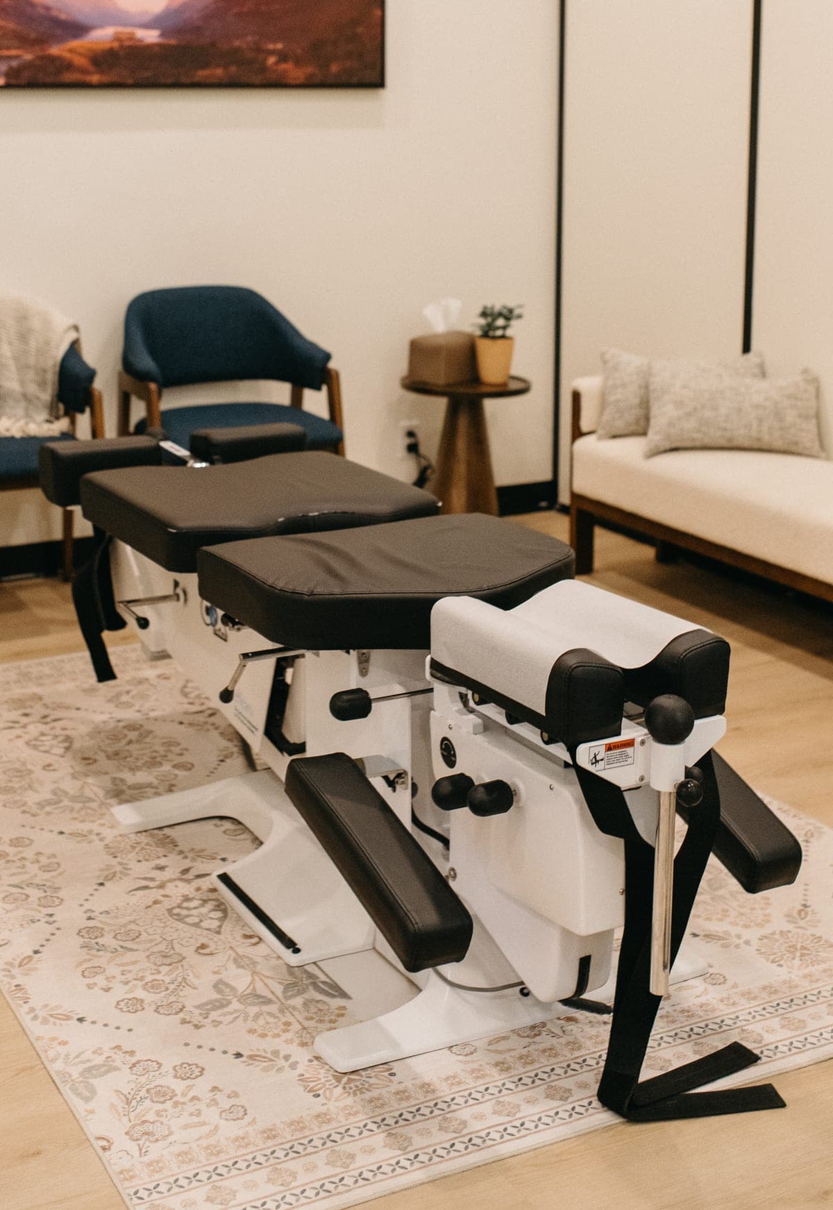 Cox Flexion-Distraction table in a treatment room at Summit Spine Centre in Airdrie